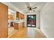 Bright kitchen and dining area with wood floors, cabinets, and sliding door to the outside at 5275 Cody St, Arvada, CO 80002