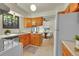 Functional kitchen featuring wood cabinets, a bright window, and updated appliances at 5275 Cody St, Arvada, CO 80002