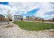 Over-sized backyard featuring a sprawling lawn, mature trees, and comfortable outdoor living spaces at 1616 Metcalf Dr, Erie, CO 80516