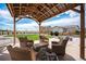 Covered backyard patio area with comfortable seating perfect for outdoor entertainment and relaxation at 1616 Metcalf Dr, Erie, CO 80516