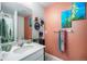 Stylish bathroom boasts modern fixtures, decorative wall art, and a soothing color palette at 1616 Metcalf Dr, Erie, CO 80516