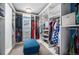 Well-organized closet featuring custom shelving, ample storage space, and a convenient bench at 1616 Metcalf Dr, Erie, CO 80516
