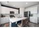 Modern kitchen featuring white cabinets, stainless steel appliances, and a breakfast bar with seating at 1616 Metcalf Dr, Erie, CO 80516