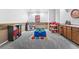 Large finished basement with stone accents, including a kitchenette and playroom area at 5231 S Greens Cir, Littleton, CO 80123