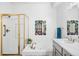 Elegant bathroom with shower, bathtub, double sink vanity, and decorative mirror at 5231 S Greens Cir, Littleton, CO 80123