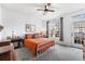 Inviting bedroom with a comfortable bed, natural light, and tasteful decor at 5231 S Greens Cir, Littleton, CO 80123