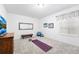 Well-lit bonus room with neutral carpet, perfect for a home gym or studio at 5231 S Greens Cir, Littleton, CO 80123