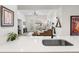View from the kitchen into a living area that features a fireplace and backyard access at 5231 S Greens Cir, Littleton, CO 80123