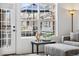 Bright living room with backyard view, a side table, and a seating area at 5231 S Greens Cir, Littleton, CO 80123