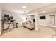 Finished basement area with carpeted floors, a sofa, a desk, and a television set at 7708 S Krameria Ct, Centennial, CO 80112