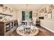 Charming dining room featuring hardwood floors, stylish decor, and ample natural light at 7708 S Krameria Ct, Centennial, CO 80112