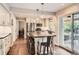 Bright eat-in kitchen featuring stainless steel appliances, an island, and sliding door access to the patio at 7708 S Krameria Ct, Centennial, CO 80112