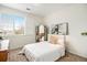 Bright bedroom with a large window and stylish decor at 8039 Lee Dr # 2, Arvada, CO 80005