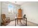Bedroom featuring a desk, rocking chair and a view of the landscape at 8039 Lee Dr # 2, Arvada, CO 80005