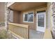Charming covered front porch with stone accents and a welcoming entryway at 8039 Lee Dr # 2, Arvada, CO 80005