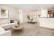 Spacious living room with modern decor and an open layout leading to the dining area and kitchen at 8039 Lee Dr # 2, Arvada, CO 80005