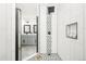 Contemporary bathroom showcasing a glass-enclosed shower, a double vanity, and modern design elements at 11710 Spruce Canyon Cir, Golden, CO 80403