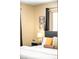 Cozy bedroom featuring soft lighting, floral artwork, and a comfortable bed with plush pillows at 11710 Spruce Canyon Cir, Golden, CO 80403