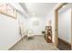 Bedroom space with carpeting, ladder with blanket, chair and plants in the background at 11710 Spruce Canyon Cir, Golden, CO 80403