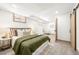 Spacious bedroom featuring a comfortable bed and view of an area with a ladder and chair at 11710 Spruce Canyon Cir, Golden, CO 80403