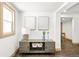 Stylish entryway with wood-look tile, a console table, and artwork at 11710 Spruce Canyon Cir, Golden, CO 80403