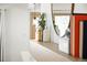 Stylish entryway shelf decor with unique bottles, a mirror, and modern lighting for a warm welcome at 11710 Spruce Canyon Cir, Golden, CO 80403