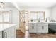 Modern kitchen with stainless appliances, stylish hardwood floors, and ample natural light at 11710 Spruce Canyon Cir, Golden, CO 80403