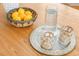 Close-up shot of a stylish dining table with decorative objects, lemons, glassware and a metallic tray at 11710 Spruce Canyon Cir, Golden, CO 80403