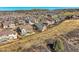 Wide aerial shot of a housing development nestled in a hilly landscape at 1815 Avery Way, Castle Rock, CO 80109