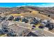 Aerial view of a suburban neighborhood with well-maintained homes and tree-lined streets at 1815 Avery Way, Castle Rock, CO 80109