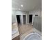 Bright bathroom showcasing double sinks, a walk-in shower, and access to closet and toilet at 1815 Avery Way, Castle Rock, CO 80109