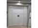 White sliding doors to closet with black hardware and reflective mirror at 1815 Avery Way, Castle Rock, CO 80109