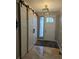 Spacious entryway with sliding barn doors, decorative window, and tile floors at 1815 Avery Way, Castle Rock, CO 80109