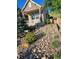 Attractive front yard with rock features, lush plants, and a charming home with an American flag at 1815 Avery Way, Castle Rock, CO 80109