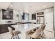 Kitchen featuring a large island with seating, pendant lights, and stainless appliances at 1815 Avery Way, Castle Rock, CO 80109