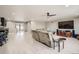 Bright and spacious living room featuring an open floor plan, modern furniture, and a ceiling fan at 1815 Avery Way, Castle Rock, CO 80109