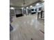 Spacious open-concept living area with wood floors provides seamless flow and plenty of natural light at 1815 Avery Way, Castle Rock, CO 80109