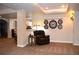 Relaxing basement area with neutral carpet, a comfortable leather recliner, and stylish lighting features at 2819 Canyon Crest Dr, Highlands Ranch, CO 80126