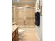 Well-lit bathroom with a shower-tub combo and granite countertops at 2819 Canyon Crest Dr, Highlands Ranch, CO 80126