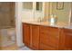 Bathroom features a vanity with double sinks, granite countertops, and a separate shower and tub at 2819 Canyon Crest Dr, Highlands Ranch, CO 80126