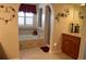 Relaxing bathroom features a soaking tub, a separate shower, and decorative accents at 2819 Canyon Crest Dr, Highlands Ranch, CO 80126