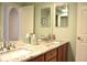 Bathroom featuring double sinks and a spacious counter at 2819 Canyon Crest Dr, Highlands Ranch, CO 80126