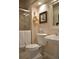 Cozy bathroom features a glass enclosed shower, white fixtures and decorative accents at 2819 Canyon Crest Dr, Highlands Ranch, CO 80126