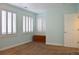 Light and airy bedroom featuring plantation shutters, neutral paint, and a classic wooden chest adding character at 2819 Canyon Crest Dr, Highlands Ranch, CO 80126