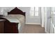 Cozy bedroom featuring soft carpet and warm natural lighting at 2819 Canyon Crest Dr, Highlands Ranch, CO 80126
