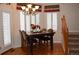 Cozy dining area with chandelier lighting, shutters and wood flooring at 2819 Canyon Crest Dr, Highlands Ranch, CO 80126