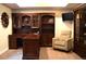 Basement home office featuring a comfortable chair, custom desk, and ample lighting at 2819 Canyon Crest Dr, Highlands Ranch, CO 80126