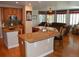 Open-concept kitchen features granite countertops, stainless steel appliances, and a breakfast bar overlooking the living area at 2819 Canyon Crest Dr, Highlands Ranch, CO 80126
