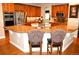 Spacious kitchen with granite countertops, stainless steel appliances and a central island at 2819 Canyon Crest Dr, Highlands Ranch, CO 80126