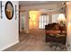 Inviting living room with neutral carpet, plantation shutters, comfortable couches, and stylish lighting at 2819 Canyon Crest Dr, Highlands Ranch, CO 80126